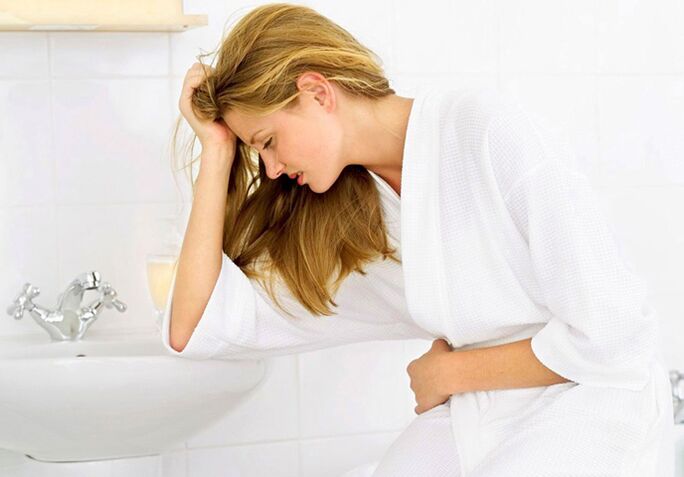 A woman is concerned about symptoms of cystitis, such as frequent urination and painful urination